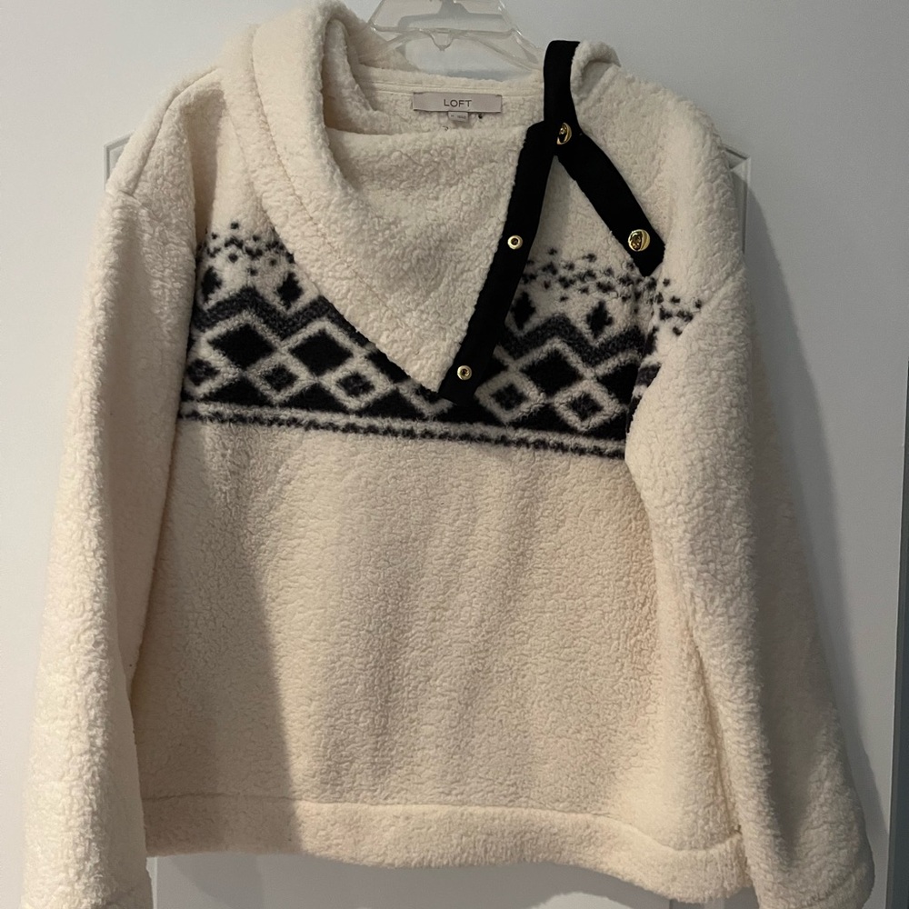 Loft size medium pullover fleece, white with black and gray design across front.